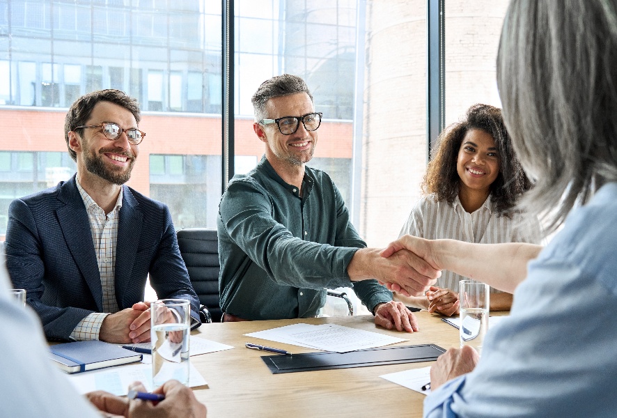 Group of professionals having a meeting at a conference room table Group of professionals having a meeting at a conference room table